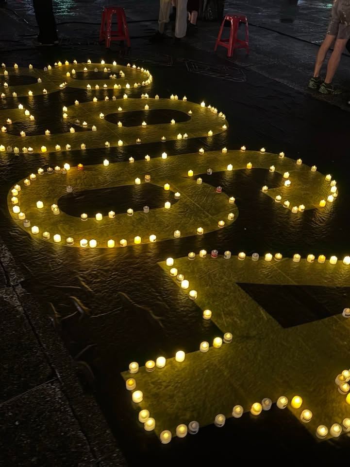 Candles arranged to form "6・4"